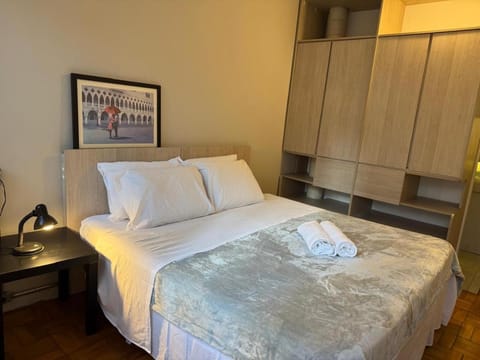 Bed, minibar, towels, wardrobe, air conditioner