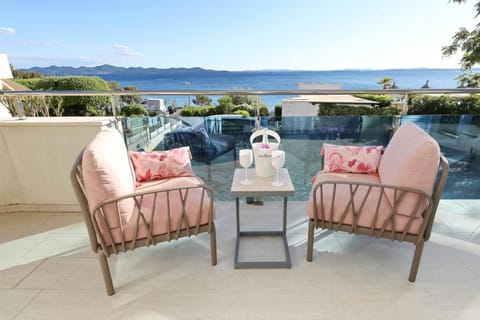 View (from property/room), Balcony/Terrace, Seating area, Sea view
