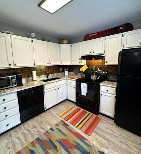 Kitchen or kitchenette, dishwasher, oven, stove, toaster