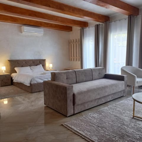 Bed, Living room, Seating area, Bedroom