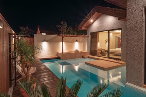 Property building, Patio, Night, Pool view, Swimming pool, sunbed
