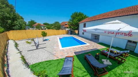 Property building, Pool view, Swimming pool, sunbed