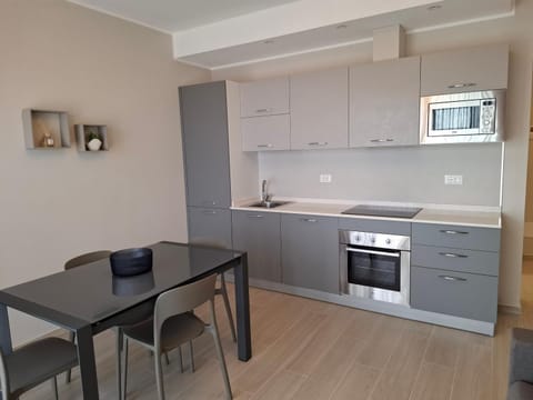 Dining area, dishwasher, oven, stove