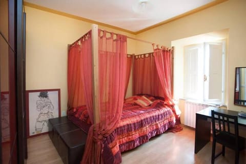 Torretta 16 red room Vacation rental in Tuscania