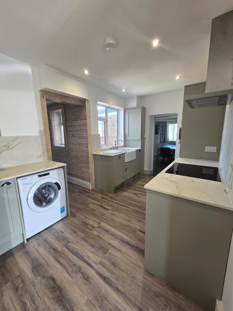 Kitchen or kitchenette, dishwasher, stove, washing machine