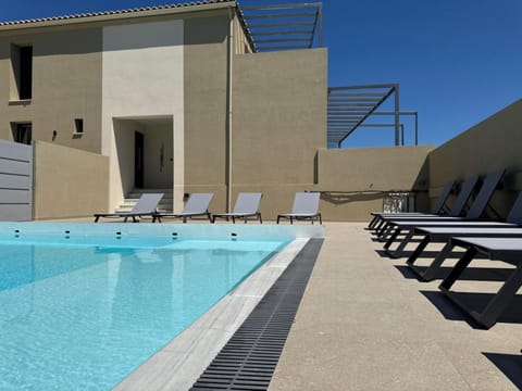 Property building, Patio, Day, Pool view, Swimming pool, sunbed