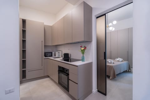 Bed, Coffee/tea facilities, Kitchen or kitchenette, Photo of the whole room, Bedroom, dishwasher, furniture, heating, heating, microwave, oven, stove, wardrobe, air conditioner
