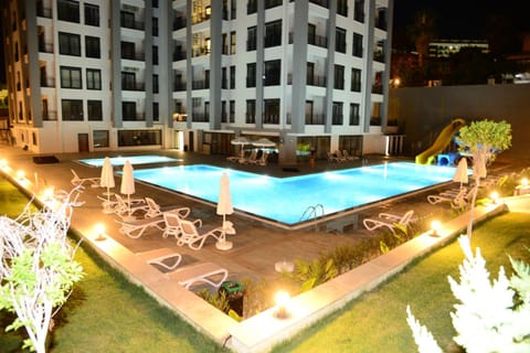 Property building, Night, Pool view, Swimming pool, sunbed