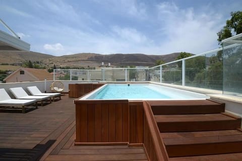 Property building, Patio, Mountain view, Pool view, Swimming pool, sunbed