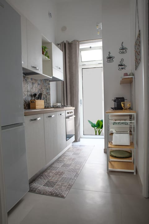 Kitchen or kitchenette, dishwasher, oven, stove