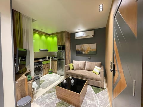 TV and multimedia, Kitchen or kitchenette, Living room, Seating area, Dining area, oven, stove, air conditioner