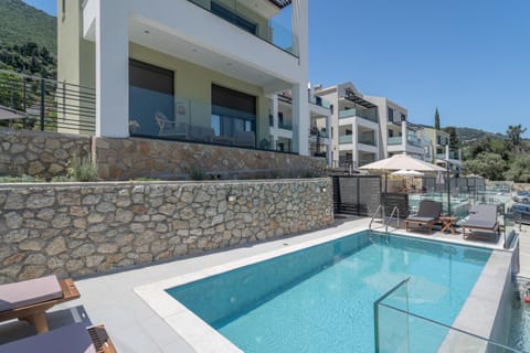 Property building, Living room, Swimming pool