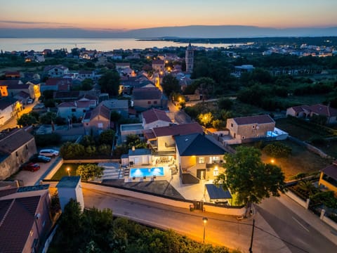 Property building, Neighbourhood, Natural landscape, Bird's eye view, Sea view, Street view, Sunrise, Sunset