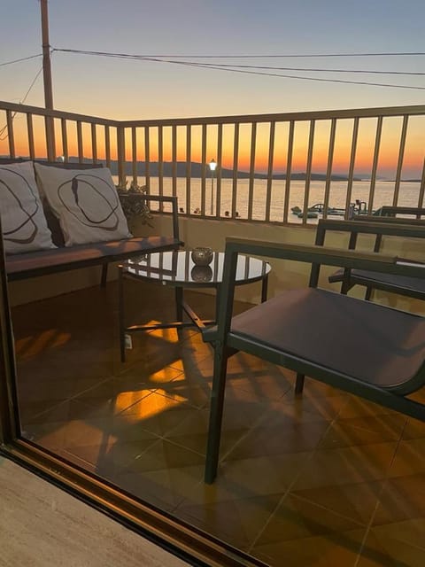 View (from property/room), Balcony/Terrace, Seating area, Sunset