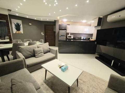 Communal lounge/ TV room, Balcony/Terrace, Living room, Seating area, Dining area, Garden view, Family, furniture, air conditioner, air conditioner