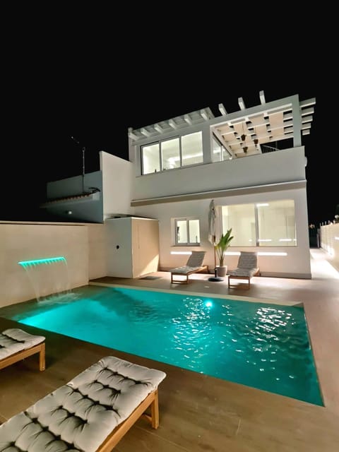 Property building, Night, Pool view, Swimming pool, sunbed