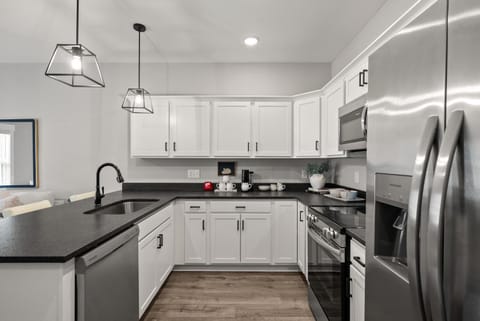 Kitchen or kitchenette, dishwasher, oven, stove, toaster