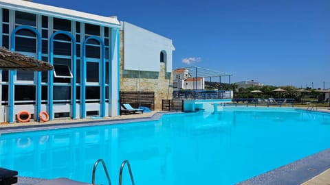 Property building, Pool view, Swimming pool, sunbed