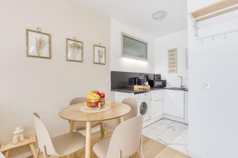 Coffee/tea facilities, Kitchen or kitchenette, Decorative detail, Dining area, group of guests, microwave, storage, stove, toaster, washing machine