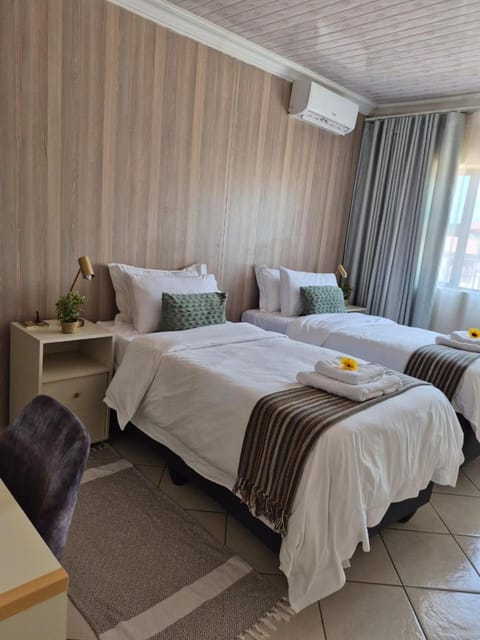 Bed, Photo of the whole room, Bedroom, towels, air conditioner