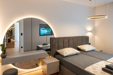 Bed, TV and multimedia, Seating area, Bedroom, air conditioner