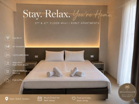 Bed, Property logo or sign, Photo of the whole room, Logo/Certificate/Sign, Bedroom, Text overlay, towels