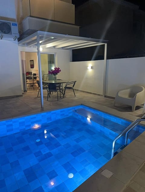 Patio, Night, Pool view, Swimming pool, sunbed