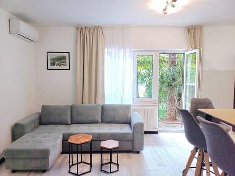 TV and multimedia, Living room, Seating area, Garden view, internet, air conditioner