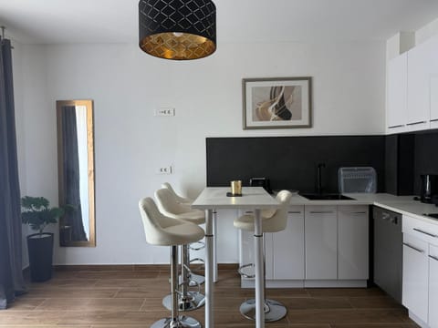 Kitchen or kitchenette, Dining area, dishwasher, stove, toaster