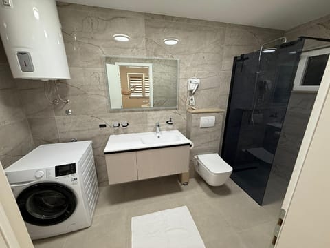 Shower, Toilet, Bathroom, towels, washing machine, dryer