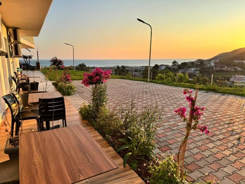 Property building, Patio, Day, Natural landscape, View (from property/room), Balcony/Terrace, Dining area, Mountain view, Sea view, Sunrise, Sunset