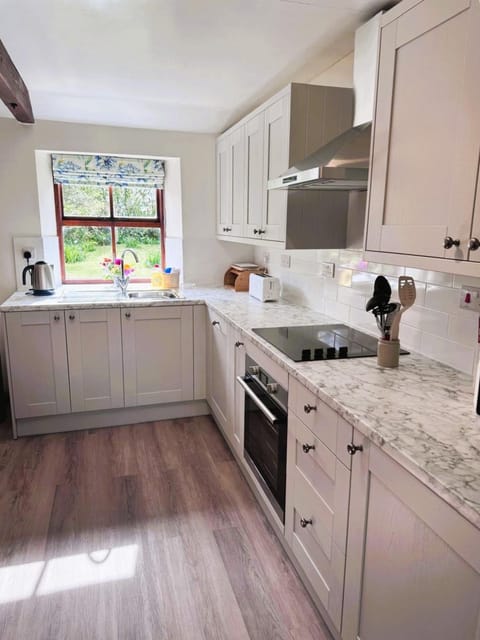 Kitchen or kitchenette, Garden view, dishwasher, microwave, oven, stove, toaster, washing machine