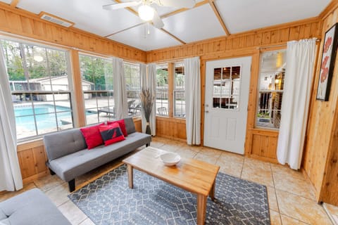 Living room, Seating area, Pool view
