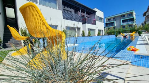 Property building, Pool view, Swimming pool, sunbed