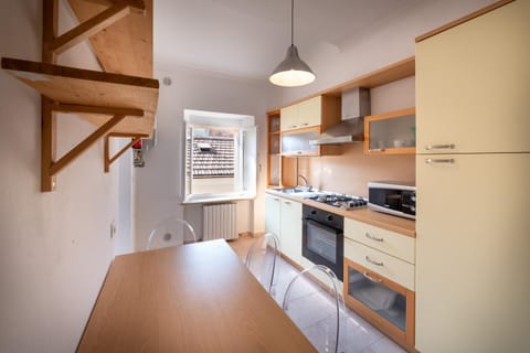 Kitchen or kitchenette, dishwasher, oven, stove