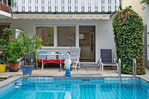 Property building, Living room, Swimming pool
