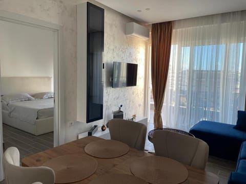 Bed, TV and multimedia, Living room, Seating area, Bedroom