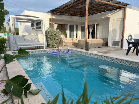 Property building, Patio, Pool view, Swimming pool, Swimming pool, sunbed
