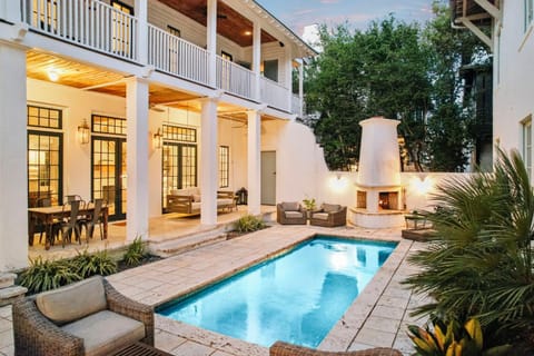 Property building, Patio, Balcony/Terrace, Seating area, Swimming pool, fireplace