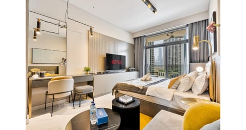 Bed, TV and multimedia, Living room, Seating area, Bedroom