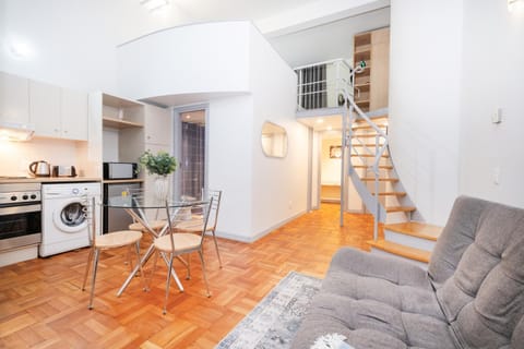 Kitchen or kitchenette, Living room, Seating area, Dining area, microwave, oven, stove, washing machine