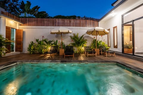 Property building, Patio, Night, Pool view, Swimming pool, sunbed