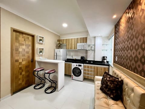 Kitchen or kitchenette, stove, washing machine
