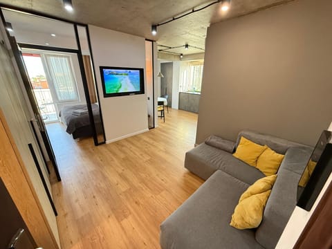 Bed, TV and multimedia, Living room, Seating area, Bedroom