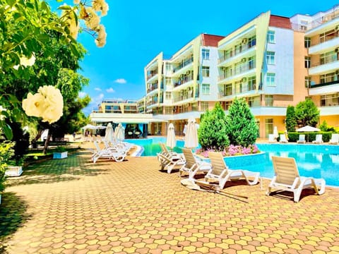 Property building, Patio, Day, Natural landscape, Pool view, sunbed