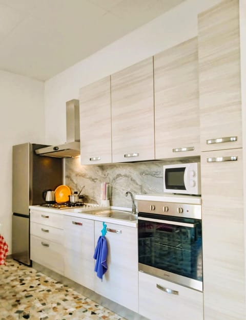 Kitchen or kitchenette, dishwasher, oven, stove