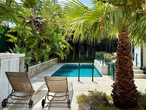 Swimming pool, sunbed