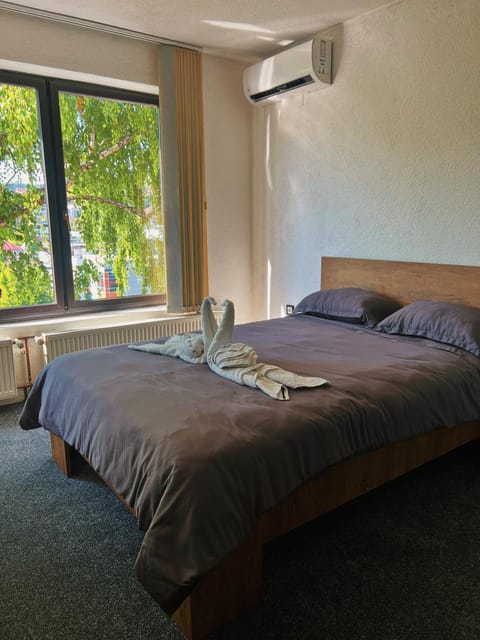 Bed, Photo of the whole room, Bedroom, towels, air conditioner