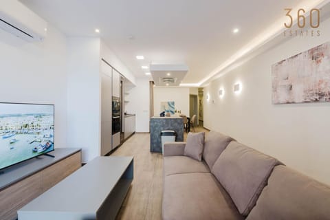 TV and multimedia, Kitchen or kitchenette, Living room, Seating area, Text overlay, minibar, oven, air conditioner