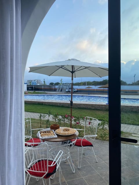Patio, Day, Natural landscape, Dining area, Pool view, Swimming pool, sunbed